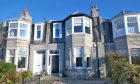 This photo shows the property's beautiful granite facade