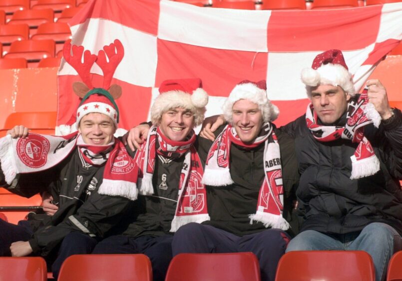 The Aberdeen players were in festive mood in December 2001. Pictured wearing Santa hats are, from left to right, are Derek Young, Jamie McAllister, Ryan Esson and Peter Kjaer.