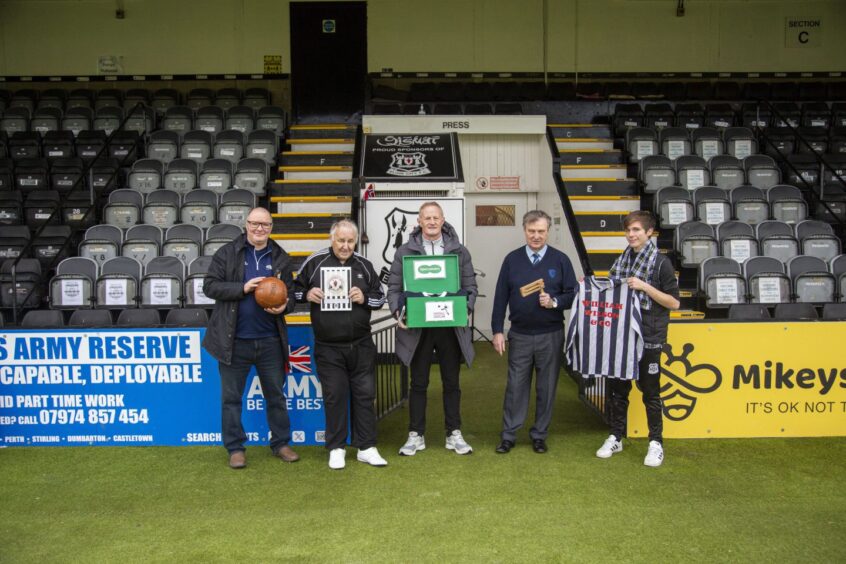 From the Football Memories session at Elgin City last week. From left: Football Memories Scotland's Richard McBrearty, project participant Mike Tommy Ellis, Colin Hendry, Bill Machray and Elgin City's community development co-ordinator Dominic Barstow. They are pictured with the Specsavers-sponsored memory boxes and examples of items used in the session, such as a football, old-style rattle and football jersey.