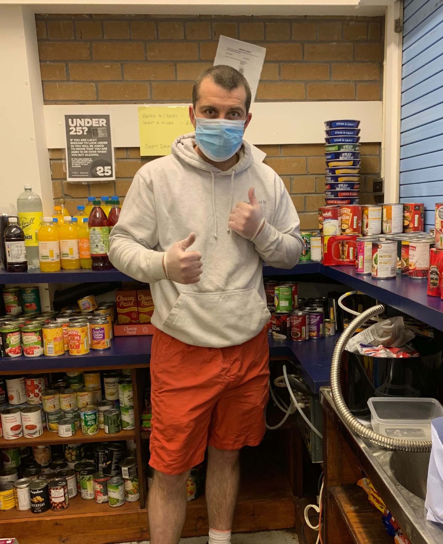 Boxing champion Lee McAllister sorting food bank donations to deliver to families during the Covid-19 pandemic.