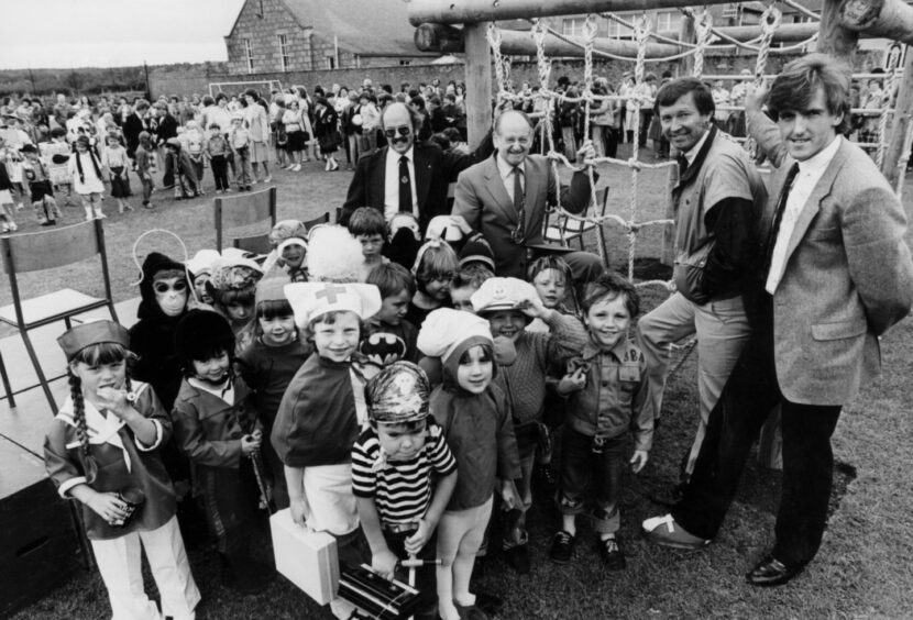 Aberdeen manager Alex Ferguson and player Peter Weir judged a fancy dress competition during the official opening of the Market Place School playing fields in Inverurie in 1984.