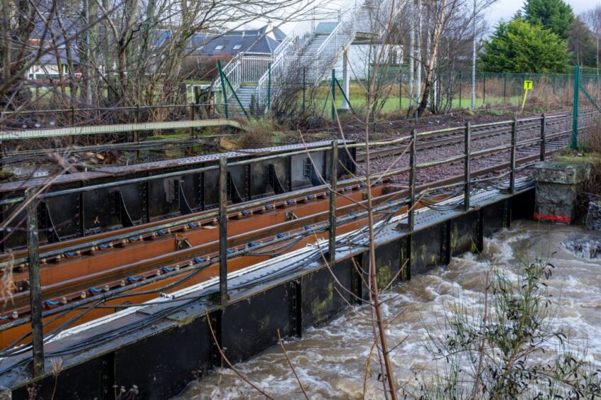 Flood water from the Gynack Burn raised and impeding on the Highland Main Line.