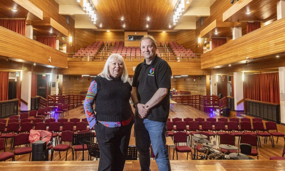 Jackie Andrews and Donnie Squair standing on Elgin Town Hall stage. 