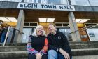 Jackie Andrews and Donnie Squair sitting on staires outside Elgin Town Hall.