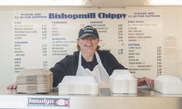 Allison Birse behind counter of Bishopmill Chippy.