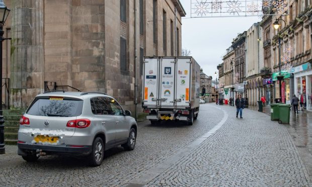 Cars parked on Elgin Plainstones.