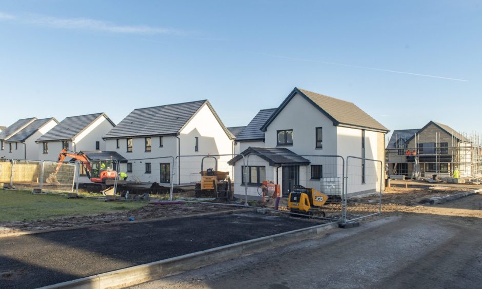 Elgin housing under construction viewed from ground level. 