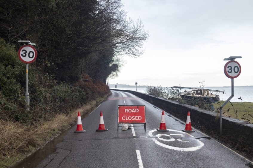 Road closed sign and cones on the A832.