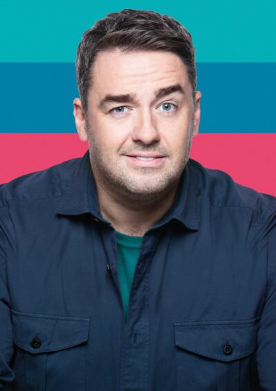 Headshot of Jason Manford with blue and pink background.