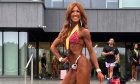 Jen Coventry, pictured at a bodybuilding competition, says losing her mum to cancer inspired her to take on fitness challenges.