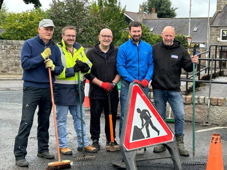 Jim and fellow volunteers out with their brushes.