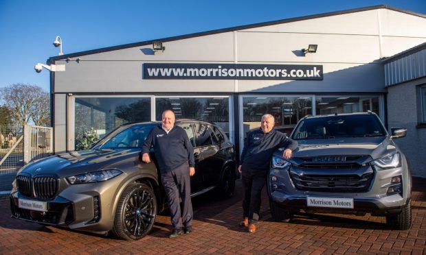 Eddie and Brian Morrison have clocked up 40 years at their dealership. Image: Kath Flannery/DC Thomson