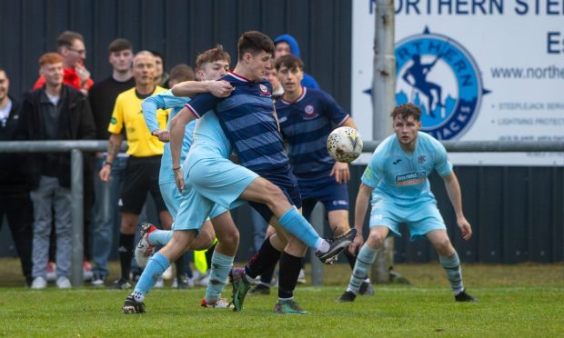 Turriff's Mackenzie Taylor in the thick of the action. 
Image: Kath Flannery/DC Thomson.