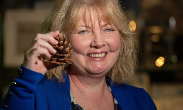 Michelle Stephenson, who has stage four breast cancer, at the Homestyle shop in Fraserburgh where she is selling her scented pine cones. Image: Kami Thomson/DC Thomson