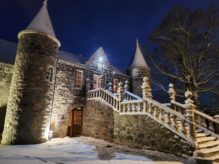 An exterior shot of Meldrum House in the snow. 