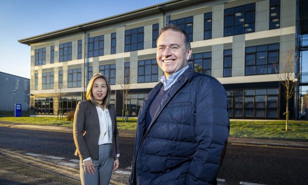 OEG office manager Toto Sanderson and CEO John Heiton outside the firms new HQ in Dyce. Image: Big Partnership