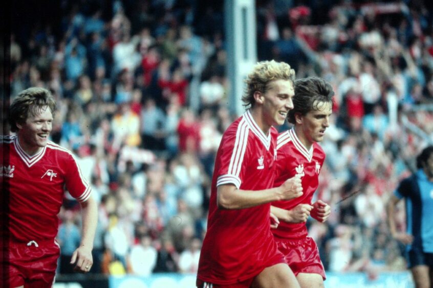 Neale Cooper and two team-mates on the pitch while playing for Aberdeen FC