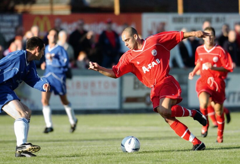 Omer Riza on the ball for Aberdeen.