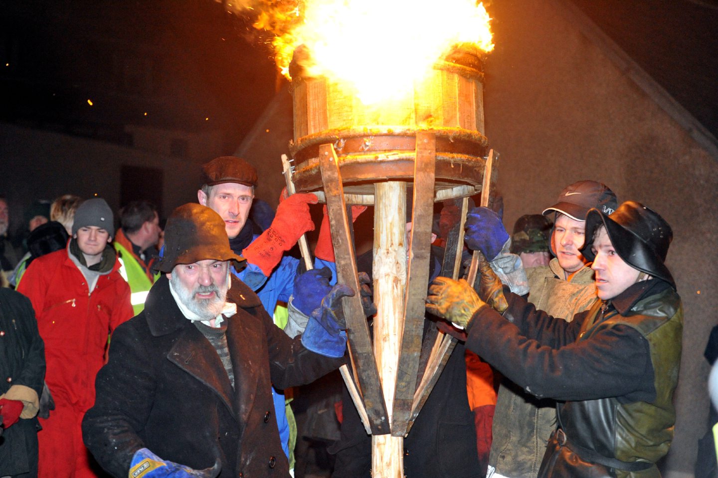 Dan and the Clavie crew with the burning Clavie.