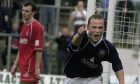 Kenny Gilbert celebrates after scoring a late equaliser in a 1-1 draw against Falkirk at Victoria Park Stadium, Dingwall, in September 2002.