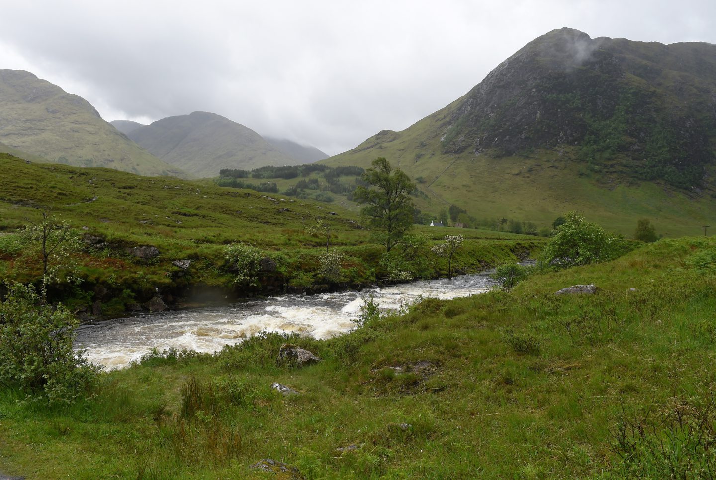 Misty mountains and burn in Glen Etive.