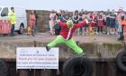 The annual Burghead Harbour swim 2024. Image: Sandy McCook/DC Thomson