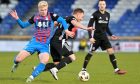 Inverness Caledonian Thistle winger Luis Longstaff takes on Cove Rangers' Fraser Fyvie during Cove's 4-1 win at the Caledonian Stadium, Inverness, on December 28, 2024.