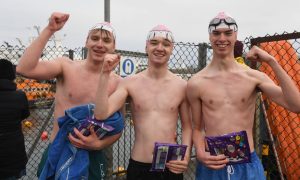 Swimmers pictured back on dry land at the Fraserburgh Lifeboat Boxing Day Swim. All images: Duncan Brown