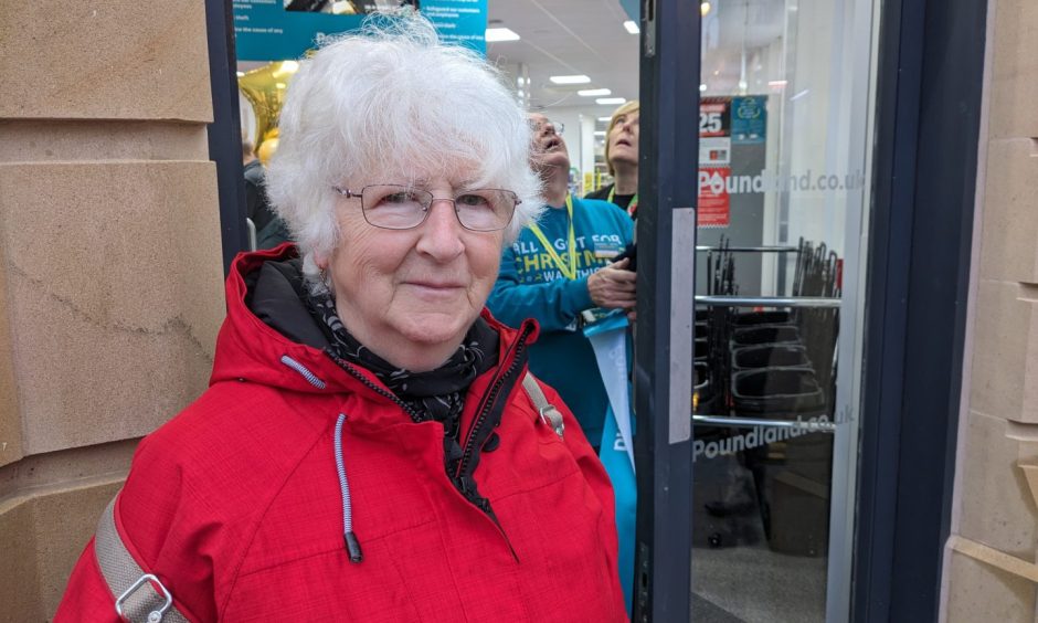 Dot Grant standing outside Elgin Poundland. 