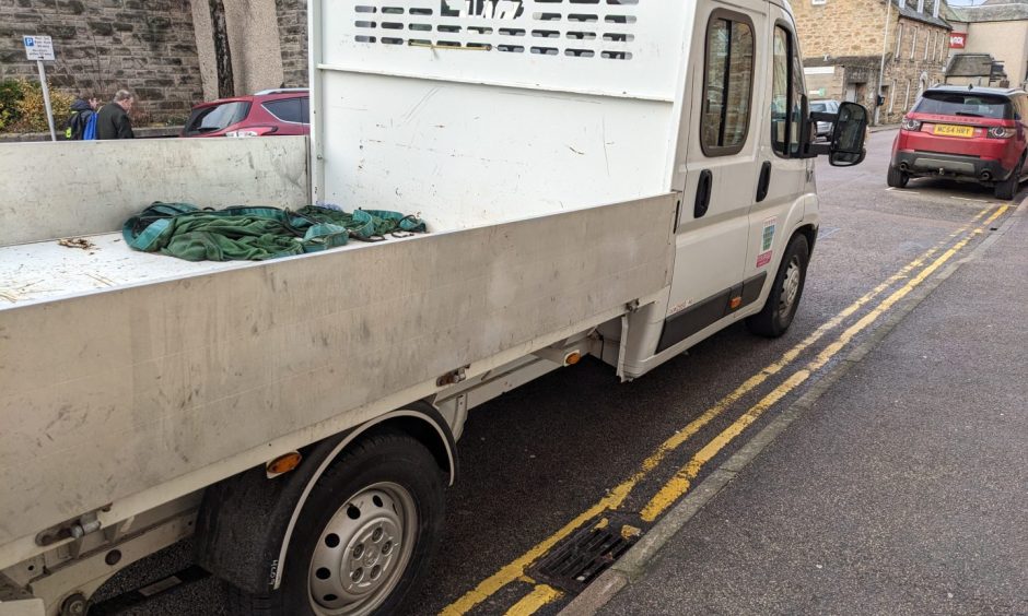 White van on double yellow lines. 