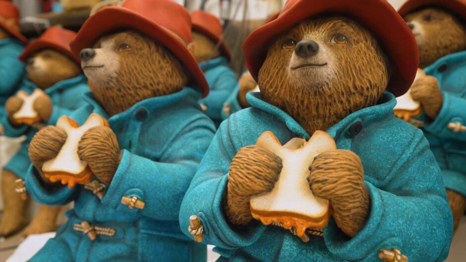 Paddington Bear statue with his marmalade sandwich