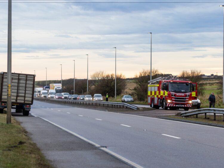 Traffic queuing behind fire engine 