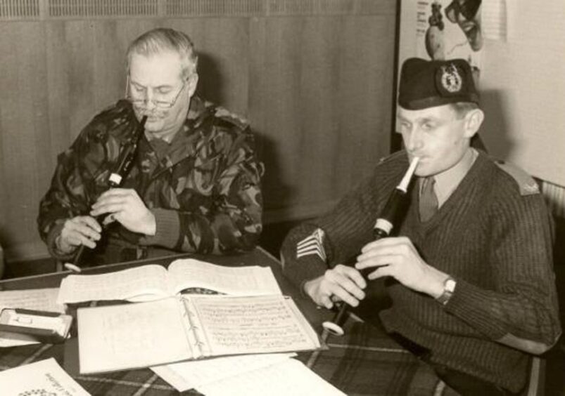 Sir Peter Graham practicing on the chanter with Pipe Major Samson, Berlin 1994