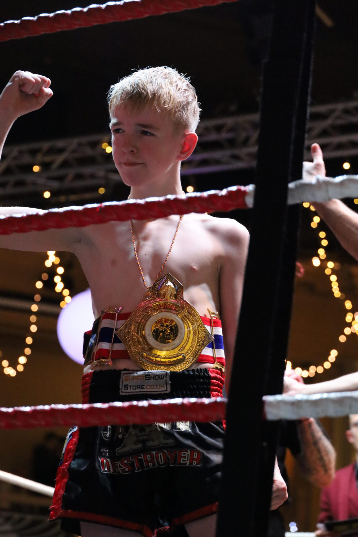 Aberdeen Muay Thai fighter Jaxon 'The Destroyer' Ritchie in the ring with with his title following his win at the Beach Ballroom.