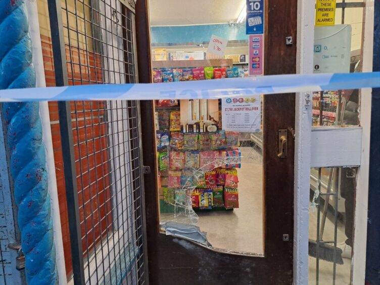 Greig Street Newsagents with door smashed