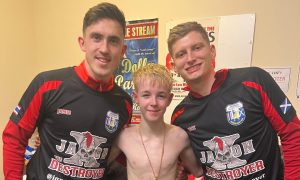 Jaxon 'The Destroyer' Ritchie with Aberdeen FC players Jamie McGrath left, and Jack MacKenzie, after his Muay Thai bout at the Beach Ballroom.