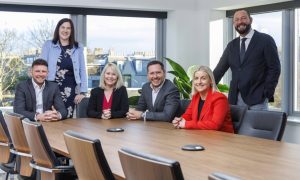 L-R Danny Anderson, Gemma Perfect, Ritchie Whyte, Elaine Elder with Nicola Gray and Rod Hutchison, both standing, form the Aberdein Considine energy team. Image: Big Partnership