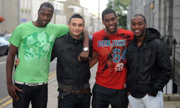 Pictured on a city street are former Aberdeen trialists, from left: Idrissa Alassane, Mazin Ahmad, Craig Rocastle and Rohan Ricketts.