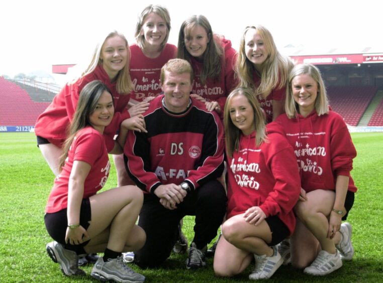 Students from the 2003 charity show pictured at Pittodrie with Duncan Shearer.