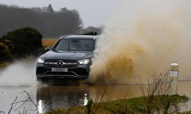 Drivers are cautioned to be careful while travelling due to surface water and flooding. Image: Kenny Elrick/ DC Thomson.