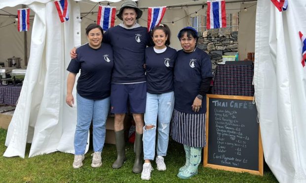 Thai Cafe staff at a pop up Thai Cafe tent at the Heb Celt festival.