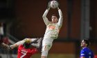 Oldham Athletic goalkeeper Mathew Hudson in action with Dan Agyei, of Leyton Orient, in the FA Cup last month at the Gaughan Group Stadium, London.