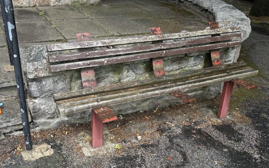 A bench in a sorry state outside the Town House was one of the first things Jim wanted to fix. 