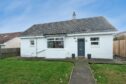 Whitewashed cottage in Cove Bay