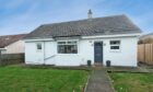 Whitewashed cottage in Cove Bay