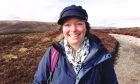 Barbara Henderson outside with mountains and moorland in the background