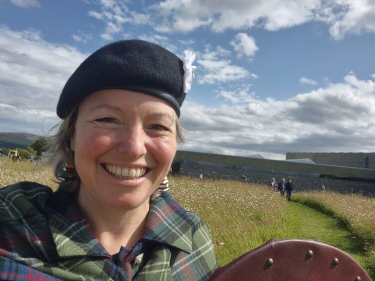 Barbara Henderson in Jacobite costume at Culloden Battlefield for a Jacobite-themed book-signing.