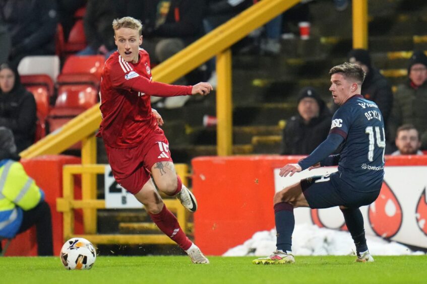 Aberdeen's Jeppe Okkels controls the ball against Hearts. Image: Shutterstock.