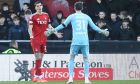 Slobodan Rubezic (33) of Aberdeen and Ross Doohan (31) of Aberdeen mix up leads to the opening goal in the 3-0 loss to St Mirren. Image; Shutterstock