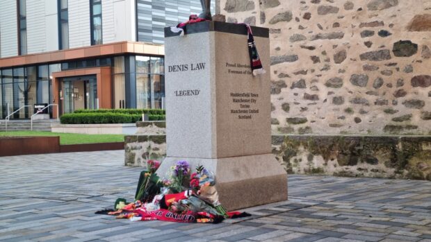 Tearful mourners pay tribute to Denis Law at Aberdeen statue